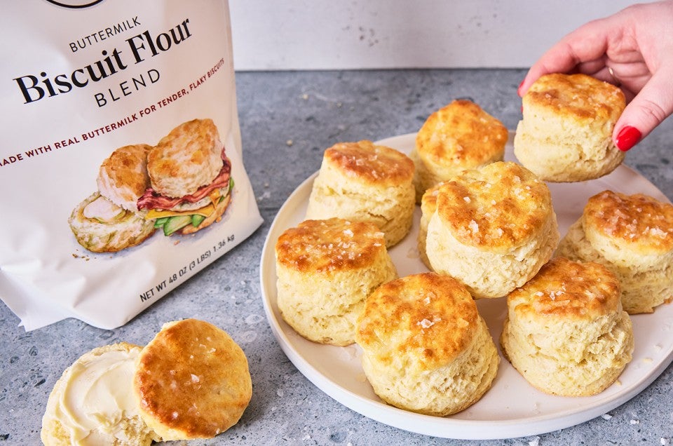 3-Ingredient Buttermilk Biscuits on a plate with a bag of flour