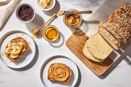 Back-of-the-Bag Oatmeal Bread served with peanut butter, bananas, and honey