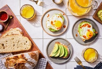 No-Knead Sourdough Bread on a cutting board with some avocado toast