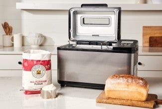 Loaf of bread in front of bread machine