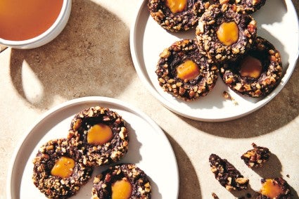 Two plates of Chocolate Caramel Thumprint Christmas cookies