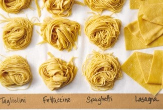 Four different types of fresh pasta noodles next to each other